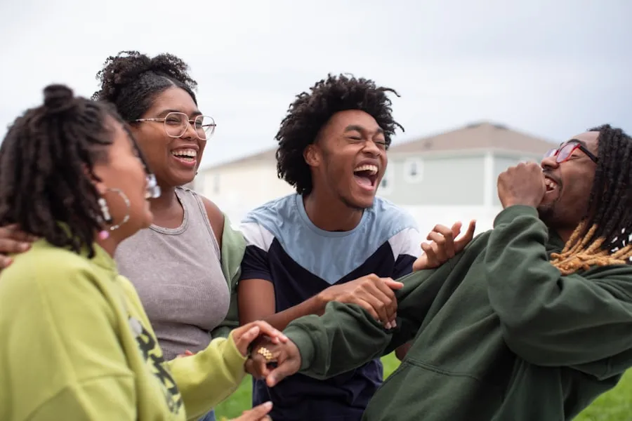 A group of friends laughing together outdoors