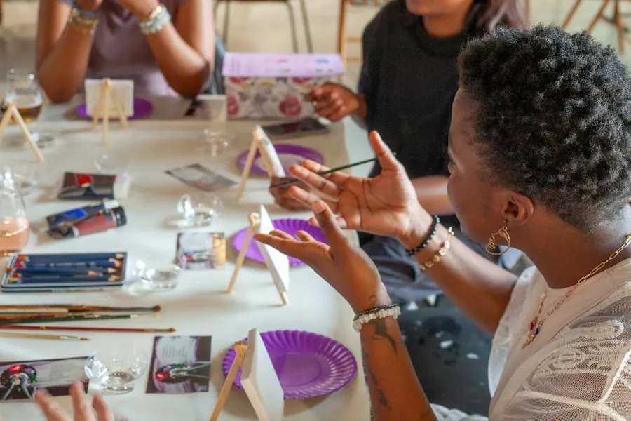 People working together at a table covered with art supplies